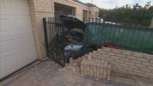 A taxi driver crashed into a home in Perth's north overnight. 