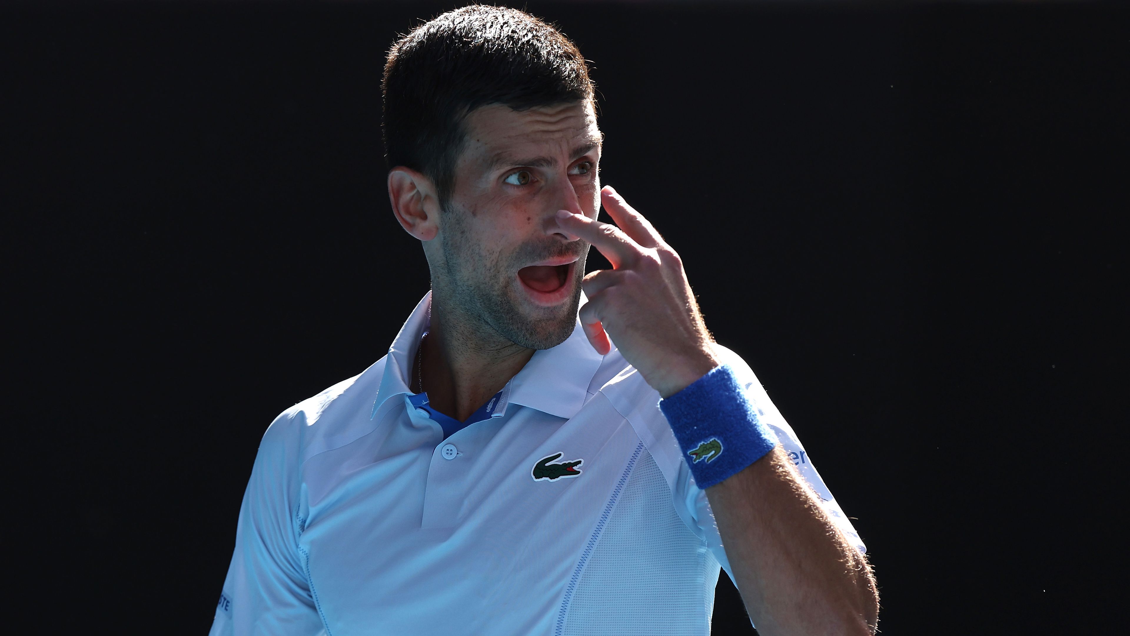 Novak Djokovic reacts in their semi-final singles match against Jannik Sinner at the 2024 Australian Open.