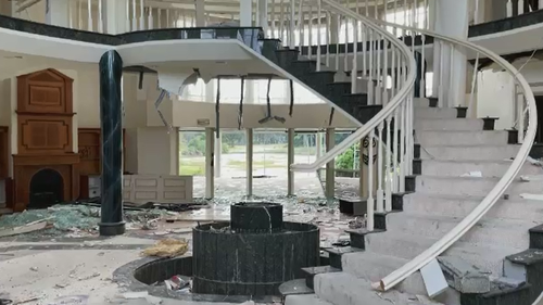 The multi-million-dollar Nerang mansion, now labelled as a "disgrace" by residents, has had its windows, walls and ceilings smashed and destroyed and is covered in graffiti. 