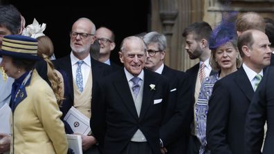Britain's Prince Philip, center, stands with other guests as he prepares to leave the chapel after the wedding of Lady Gabriella Windsor and Thomas Kingston at St George's Chapel, Windsor Castle, near London, England, Saturday, May 18, 2019