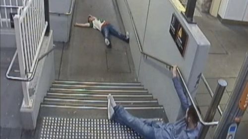 CCTV from the night shows them laying on the stairs at the train station.