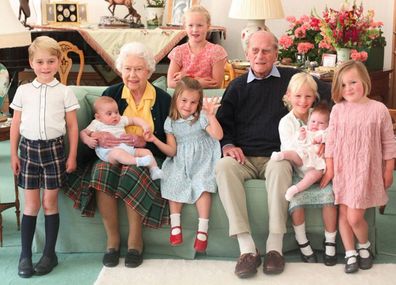 The Queen and Prince Philip surrounded by seven of their great-grandchildren at Balmoral Castle in 2018 (L-R front: Prince George, Queen with Prince Louis, Princess Charlotte, Prince Philip, Isla Phillips, Lena Tindall, Mia Tindall. Back: Savannah Phillips)