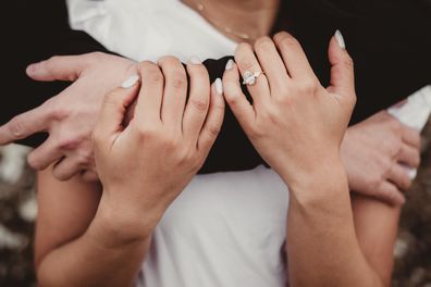 Engaged couple embracing close up