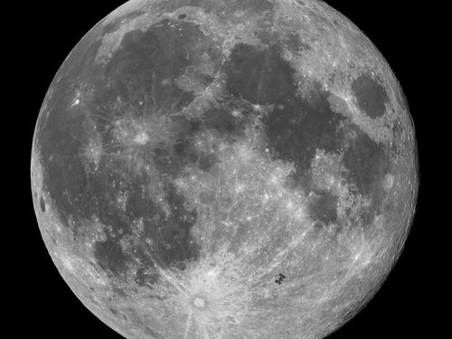 This image captures the International Space Station (ISS) in transit across October's Full Moon, the Hunter's Moon, approximately 12 hours after a partial lunar eclipse. The striking beauty of the Full Moon is on display, with its mix of rugged highlands, bright crater rays and darker maria. 