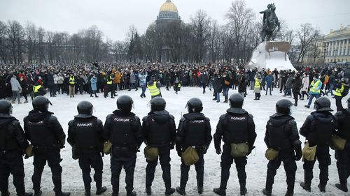 Police stand guard during a protest against the jailing of opposition leader Alexei Navalny in St. Petersburg, Russia, Saturday, Jan. 23, 2021