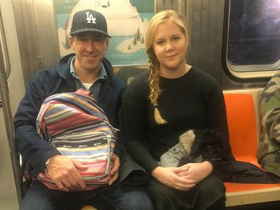Schumer, 44, announced her split from Chris Fischer, 45, in a casually worded Instagram post, accompanied by a photo of them sitting side-by-side on the train. 