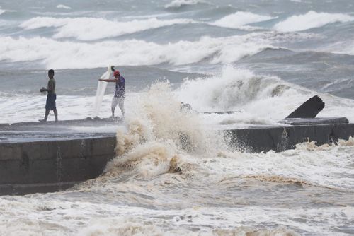 Typhoon Mangkhut slammed into the country's north-eastern coast early this morning, with witnesses saying the storm's ferocious wind and blinding rain ripped off tin roof sheets and knocked out power at the start of the onslaught.