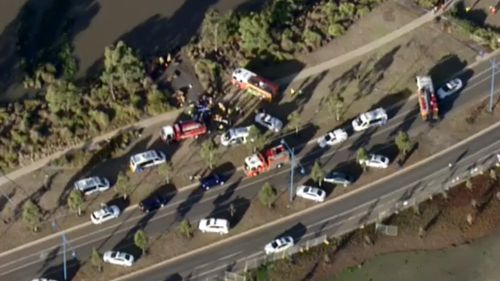 One adult and four children were inside the car when it plunged into the lake. (9NEWS)