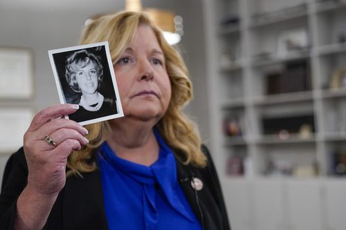 Assau County Attorney Anne Donnelly holds a photo of Diane Cusick during an interview with the Associated Press on Wednesday, June 22, 2022, in Mineola, New York. More than 50 years after a woman was found dead in her car at a mall in Long Island, prosecutors are expected to announce DNA evidence linking the murder to Richard Cottingham, a serial killer linked to 11 murders in New York and New Jersey between 1965 and 1980. (AP Photo / Mary Altaffer)