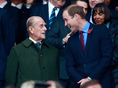 Prince Harry, Prince Phillip and Prince William enjoy the build up to the 2015 Rugby World Cup Final match between New Zealand and Australia at Twickenham Stadium on October 31, 2015 in London