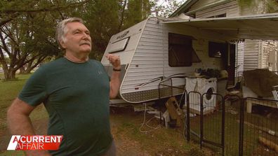 Retiree Glen Lewis said he is still living in a caravan at the front of his flood-wrecked home.