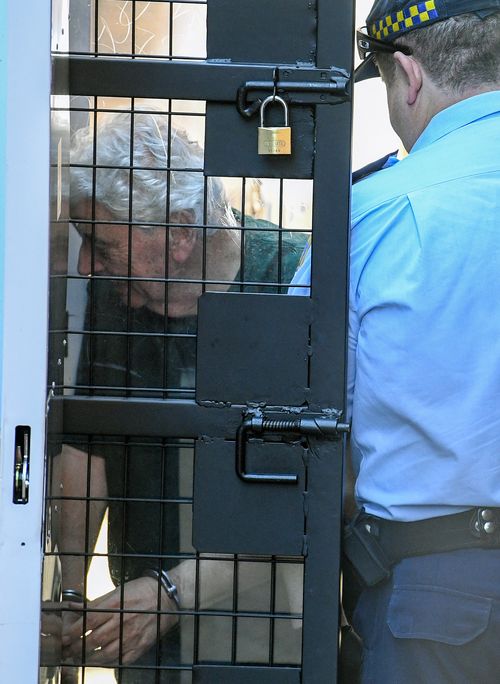 Gold Coast businessman Michael Issakidis is escorted into a prison van at the Supreme Court in Sydney today. Picture: AAP