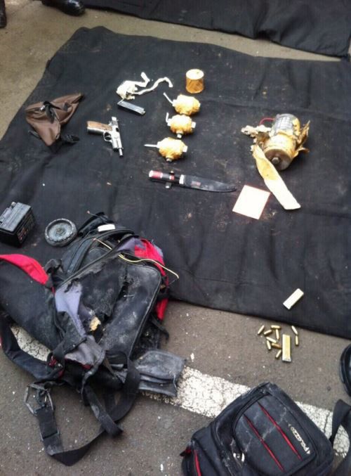 A suicide vest, explosives, pistols and a knife captured following the shootout with police. (Twitter)