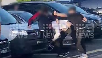 Police are investigating an alleged brawl between teenagers and a man in a business suit in a Sydney McDonald&#x27;s car park.