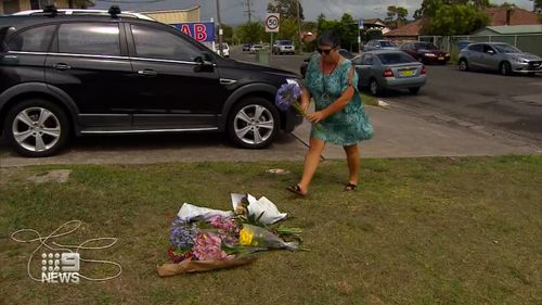 Locals lay flowers near where Mr Palmer died.