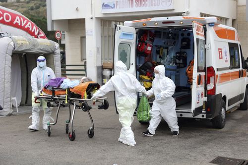 An ambulance for covid emergency unload a patient at the Cervello hospital in Palermo, Sicily on Friday, Jan. 7, 2022. 