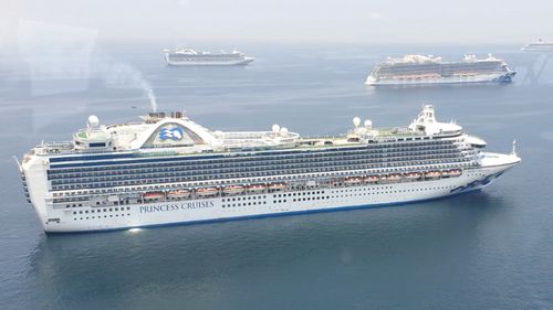 Cruise ship MV Ruby Princess sits anchored with other ships waiting for clearance from the Bureau of Quarantine before they dock in Manila, Philippines on May 7.