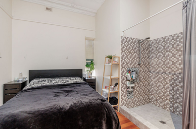 Baffling design layout in this Adelaide home sees the shower literally just a footstep or two away from the bed.