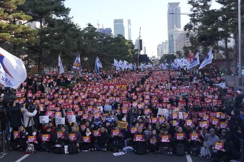 Protesters stage a rally demanding the impeachment of South Korean President Yoon Suk-yeol