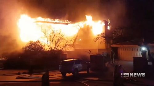 A multi-million dollar mansion in Mullaloo went up in flames last night with 11 people inside.