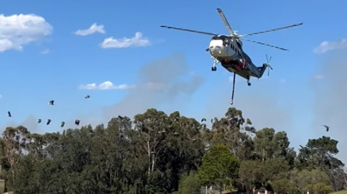 Locals in a suburb south of Sydney are being told it is too late to leave as a bushfire approaches.