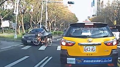<p>Dashcam footage of a cyclist left on her feet after a car smashed into the front wheel of her bike has been posted online. </p><p>
The video, which has not been verified, is either something close to a miracle captured on film, or a pretty decent piece of digital trickery. </p><p>
Purportedly from Taiwan, the footage shows a woman cycling across a pedestrian crossing in heavy traffic. </p><p>
While most of the traffic is stopped, one sedan comes speeding down the outside lane – ignoring the zebra crossing – and collects the front wheel of the woman's bike, which flies out from under her and smashes into a taxi in the opposite lane. </p><p>
The car mounts the curb and grinds to a halt, but here's the kicker: the commuter is left on her feet. </p><p>
Totally unhurt, she collects her bag, bike and presumably a bundle of shattered nerves. </p><p>
Eventually the taxi driver gets out to have a look at the front of his car, totally ignoring the woman.</p><p>
For more close calls, click though our gallery.</p>
