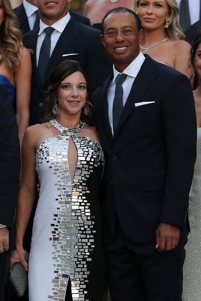 Tiger Woods of the United States poses with girlfriend Erica Herman before the Ryder Cup gala dinner.