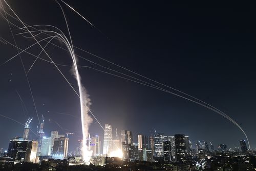 Israeli Iron Dome air defense system fires to intercept missiles over Tel Aviv, Israel, Friday, June 13, 2025. (AP Photo/Tomer Neuberg)
