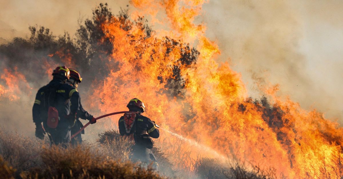 Wildfires are tearing through a popular tourist hotspot in Greece, forcing mass evacuations