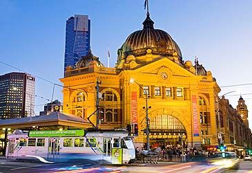 Melbourne's Flinders Street railway station is on the corner of Flinders and what other street?
