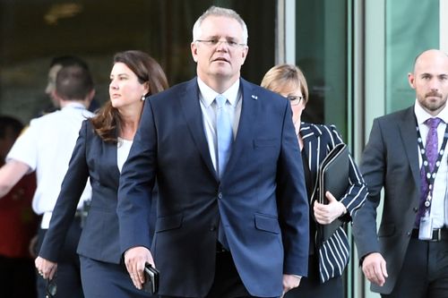 Scott Morrison emerges as Prime Minister from the partyroom meeting.