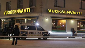Police guards the area where three people were killed in a shooting incident at a restaurant in Imatra, eastern Finland, after midnight on December 4, 2016. (AFP)