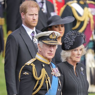 King Charles III, Camilla, the Queen Consort, Meghan, Duchess of Sussex, and Prince Harry watch as the coffin of Queen Elizabeth II is placed into the hearse following the state funeral service in Westminster Abbey in central London Monday Sept. 19, 2022. 