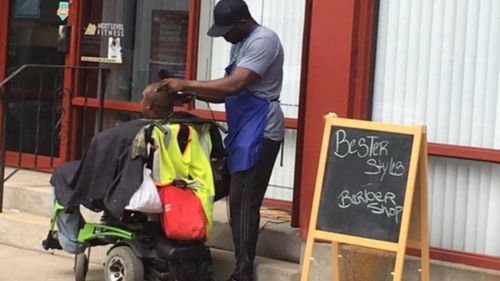 Barber cuts wheelchair-bound man’s hair on a Massachusetts street