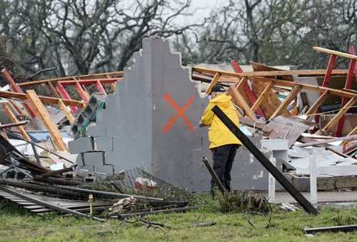 Law enforcement officials search for survivors in the aftermath of Hurricane Harvey in Rockport, Texas. (AAP)