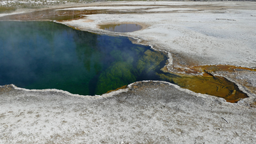 In this photo provided by the National Park Service is the Abyss Pool hot spring in the southern part of Yellowstone National Park, Wy., in June 2015. 