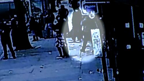 The man is seen waiting at a bus stop, seconds before the 'freak accident'.