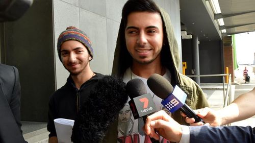 Max and Arman Jalal outside  a Melbourne police station after their arrest. (AAP)