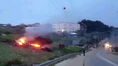 A video still shows the wreckage of a jet on fire near Harduf, northern Israel, on Saturday, February 10. (AAP)