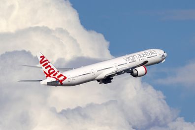Sydney, Australia - October 8, 2013: Virgin Australia Airlines Boeing 777-300 large commercial airliner aircraft taking off from Sydney Airport.