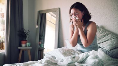 Woman in bed with flu