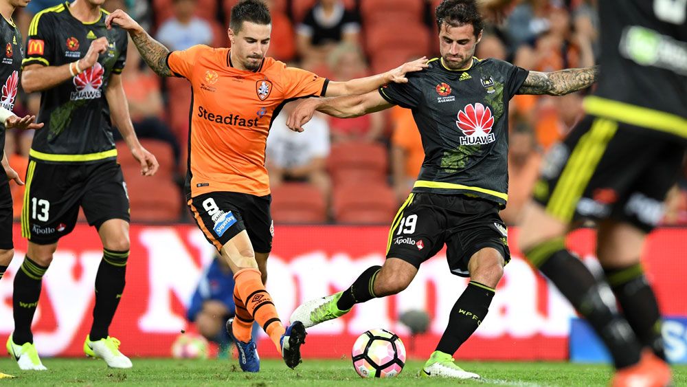 Brisbane striker Jamie Maclaren takes on the Phoenix. (AAP)