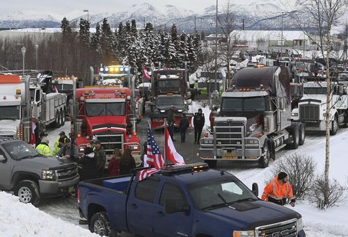 Hundreds of truckers and personal vehicles staged at Cabela's in South Anchorage before driving to Eagle River on Sunday, Feb. 6, 2022, to support Canadian truck drivers opposed to COVID-19 vaccine mandates.