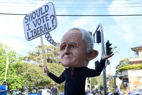 A protester dressed as former prime minister Malcolm Turnbull is seen at a polling place at Bellevue Hill, Sydney.