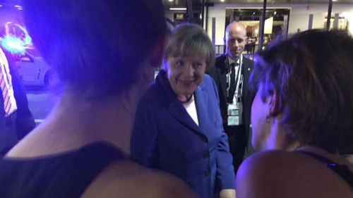 Patrons at the Brewski bar on Caxton Street meet with German Chancellor Angela Merkel. (Facebook)