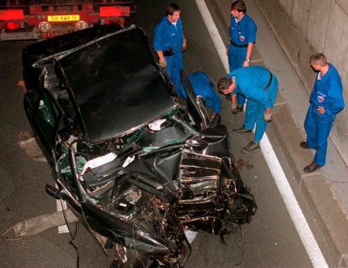 Police services prepare to take away the car in which Diana, Princess of Wales, died