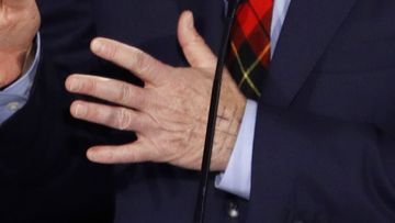 The Jerusalem Cross can be seen on Tom Steyer&#x27;s hand.