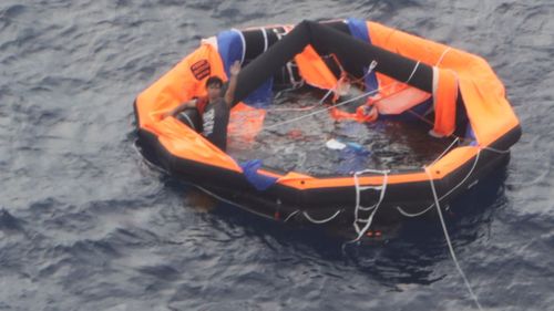 A 30-year-old Philippine national, the second survivor, of the capsized cattle ship 'Gulf Livestock 1' is seen on a life raft on September 04, 2020 in Amamioshima, Japan.