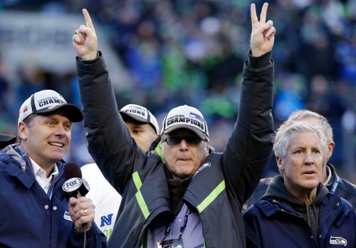 Paul Allen, centre, with coaching staff from the Seattle Seahawks NFL club he owns.