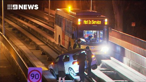 An Adelaide driver caused early morning commuter chaos after crashing his car onto the tracks of the city's O-Bahn busway.